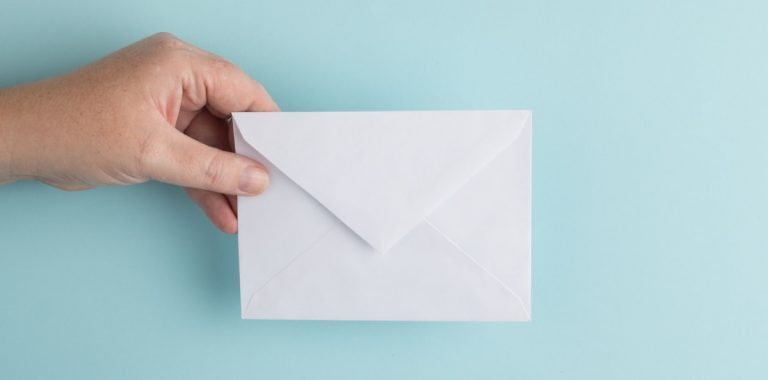 person showing white envelope